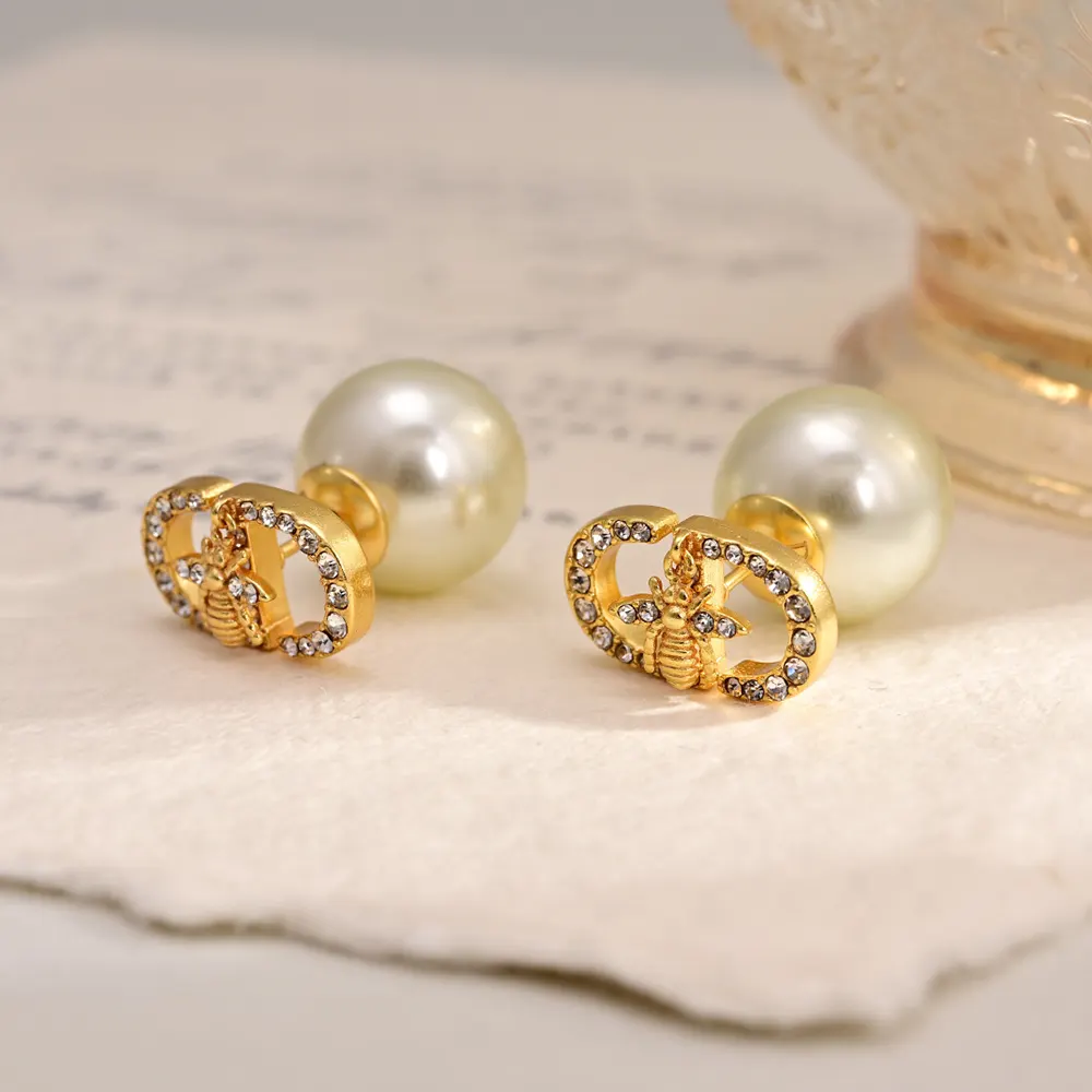Close-up detail of white resin pearls on Dior Women Tribales Earrings