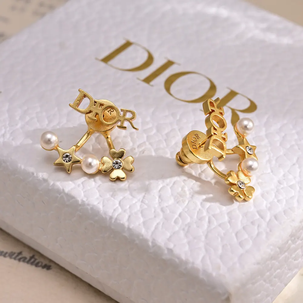 Close-up detail of white resin pearls on Dior Women Tribales Earrings