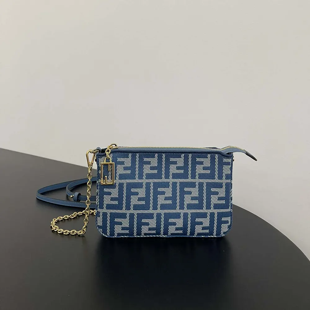 Close-up of silver-tone FF charm on Fendi Women Baguette Pouch Blue Denim-effect