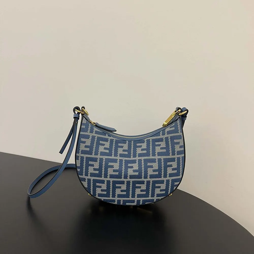 Side angle showing adjustable strap on Fendi Fendigraphy Mini Blue denim-effect bag