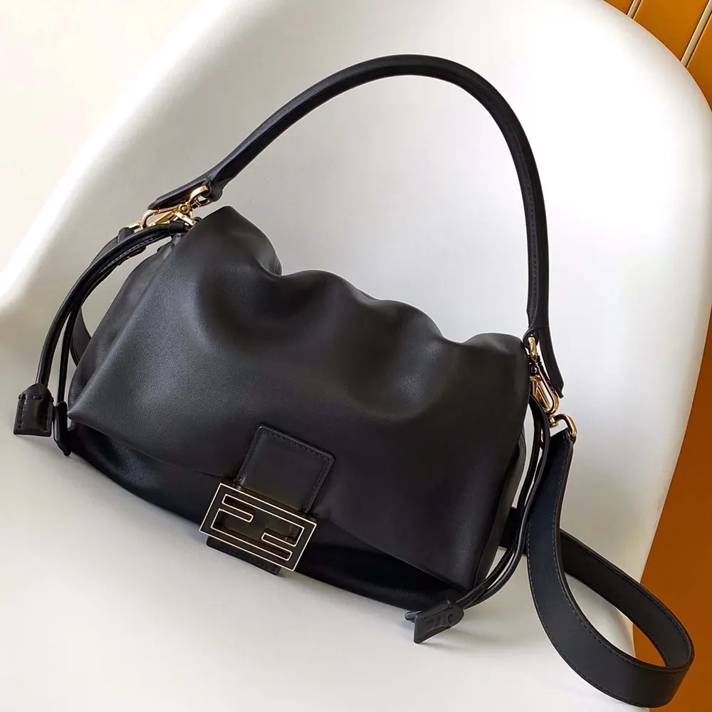 Close-up of gold-tone hardware on Fendi Women Mamma Baguette Bag
