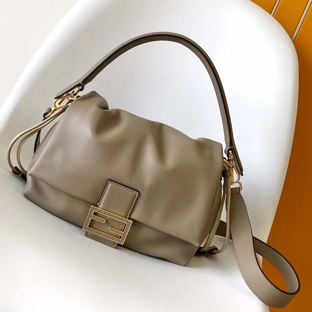 Close-up of gold-tone hardware on Fendi Women Mamma Baguette Medium bag