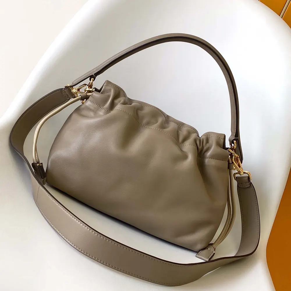 Side angle showcasing silhouette of Fendi Women Mamma Baguette Medium bag