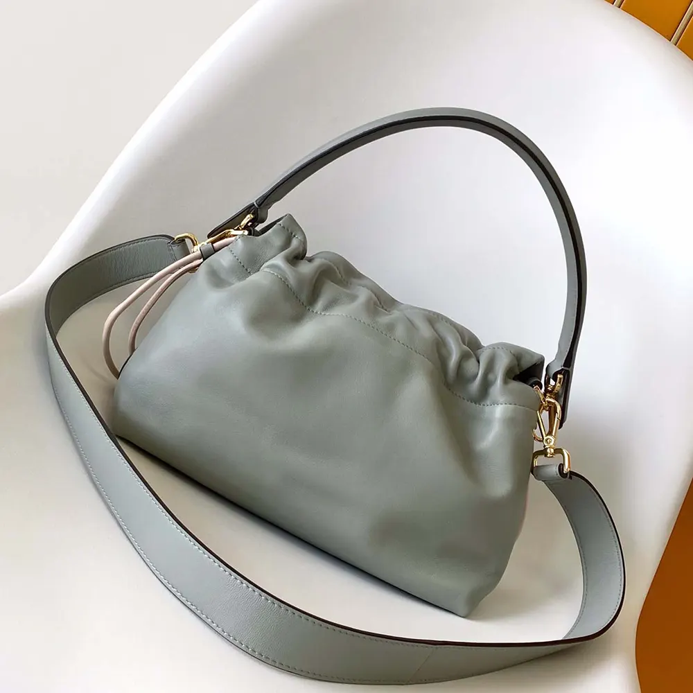 Side angle showing silhouette of Fendi Women Mamma Baguette Medium Matcha Green bag