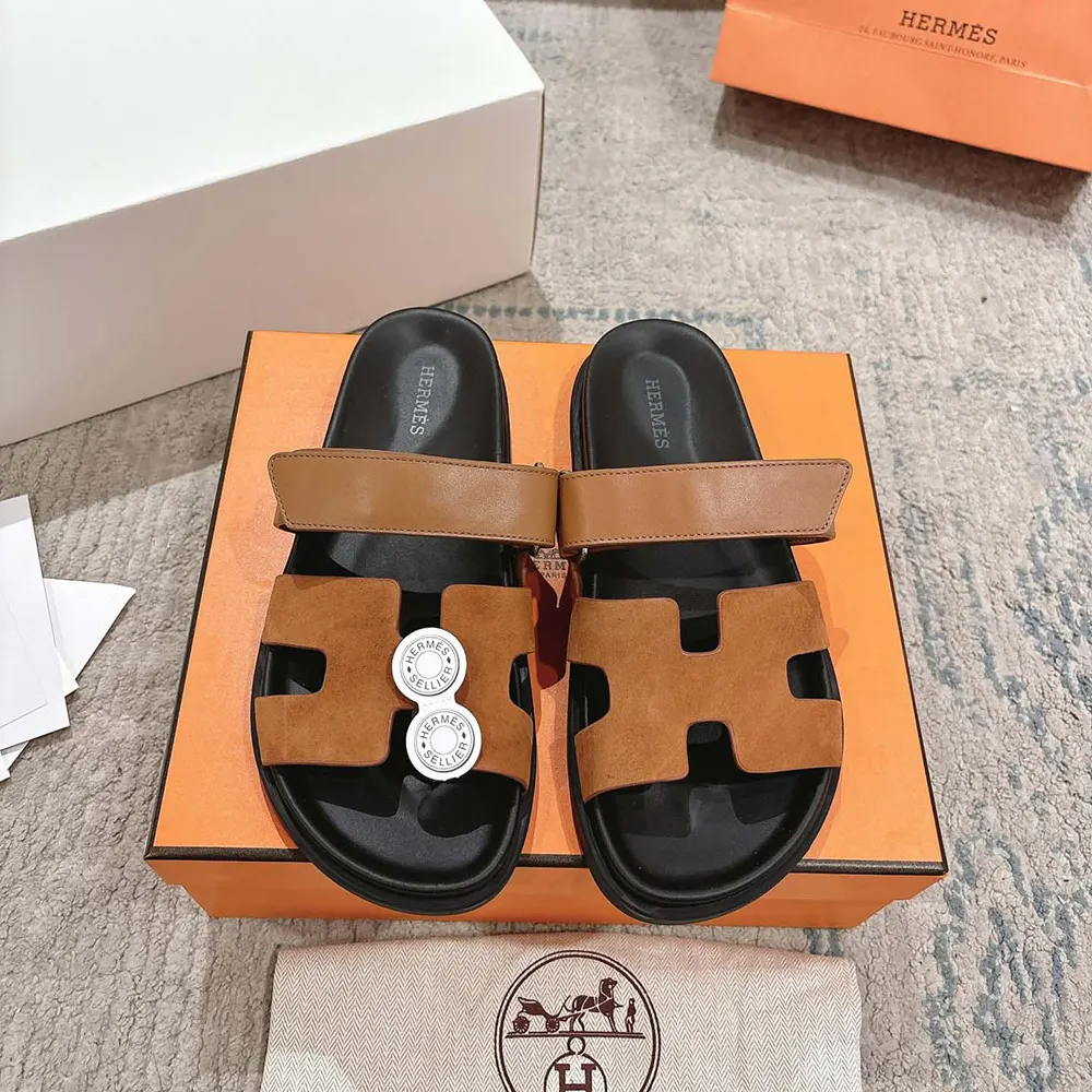Top-down close-up of Hermes Unisex Chypre Sandal-Brown signature cut-out detail