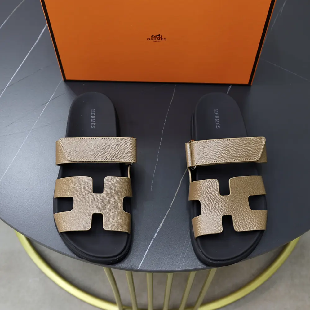 Side view of Hermes Unisex Chypre Sandal revealing silhouette and sole