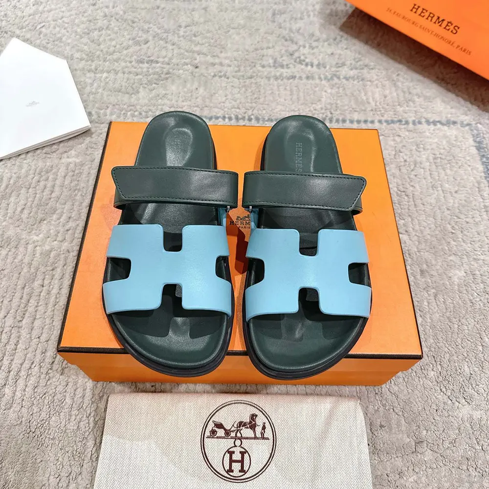 Close-up of leather and signature cut-out on Hermes Unisex Chypre Sandal