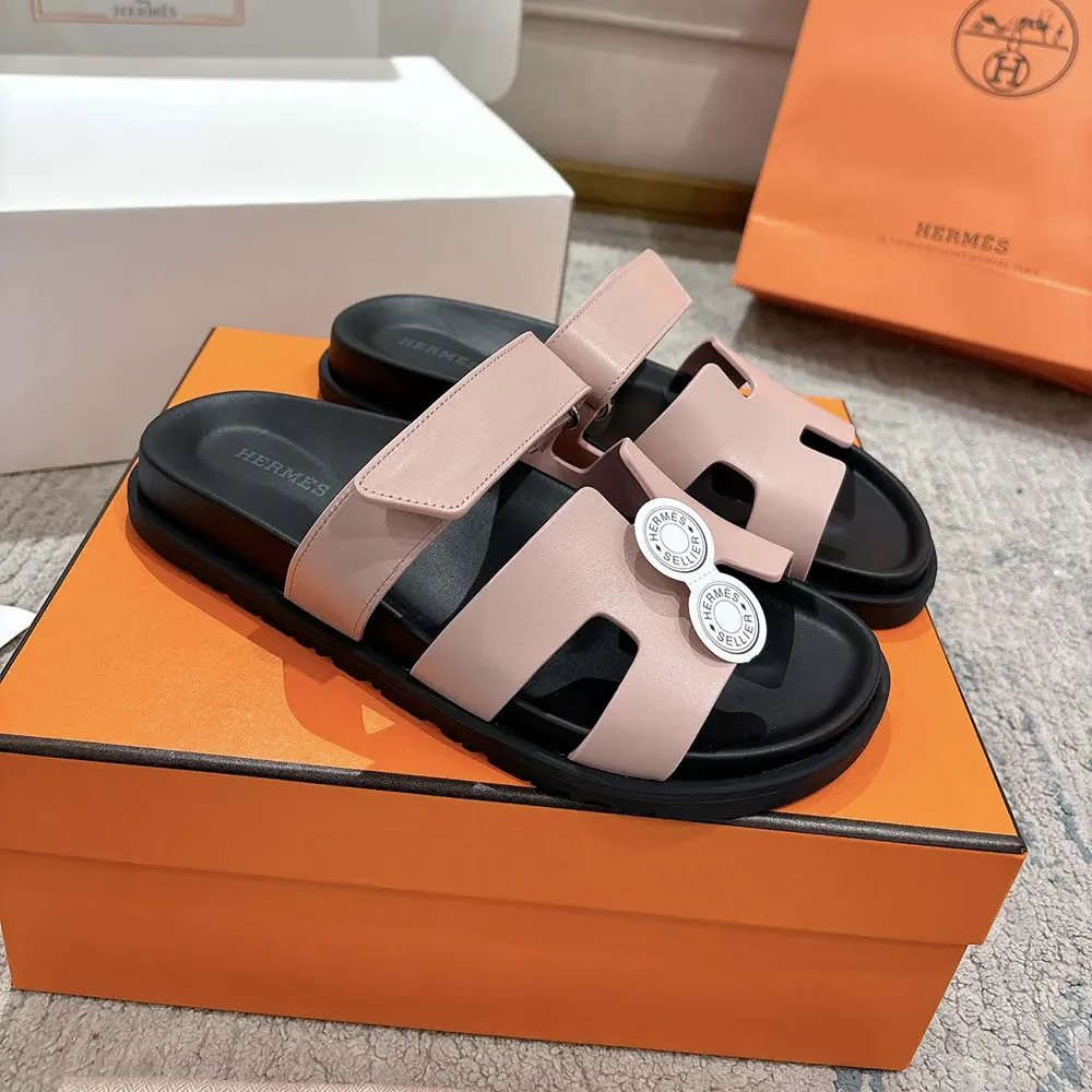 Close-up of pink Hermes 'H' hardware on Unisex Chypre Sandal