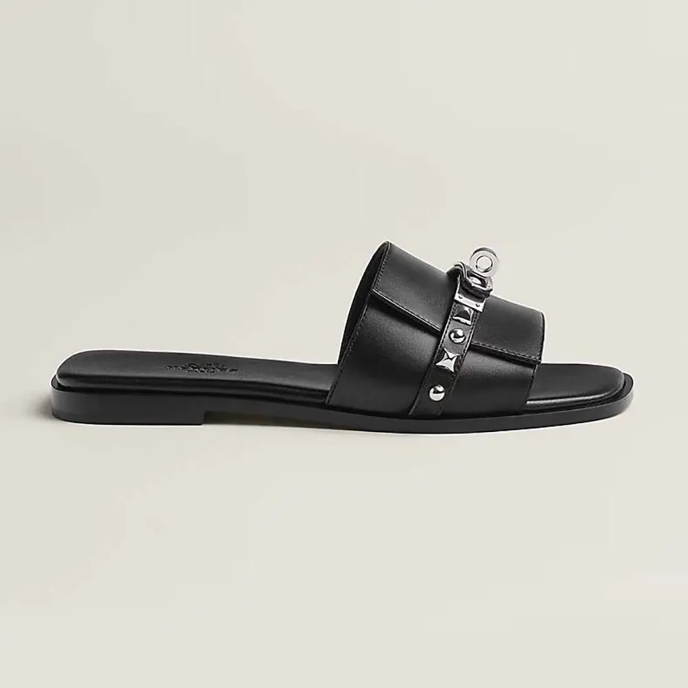 Side profile of Hermes Unisex Giulia Sandal-Black showing leather strap