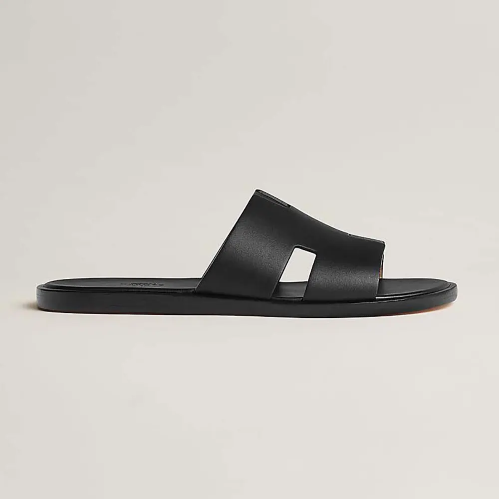 Side profile of Hermes Unisex Izmir Sandal-Black showing buckle detail
