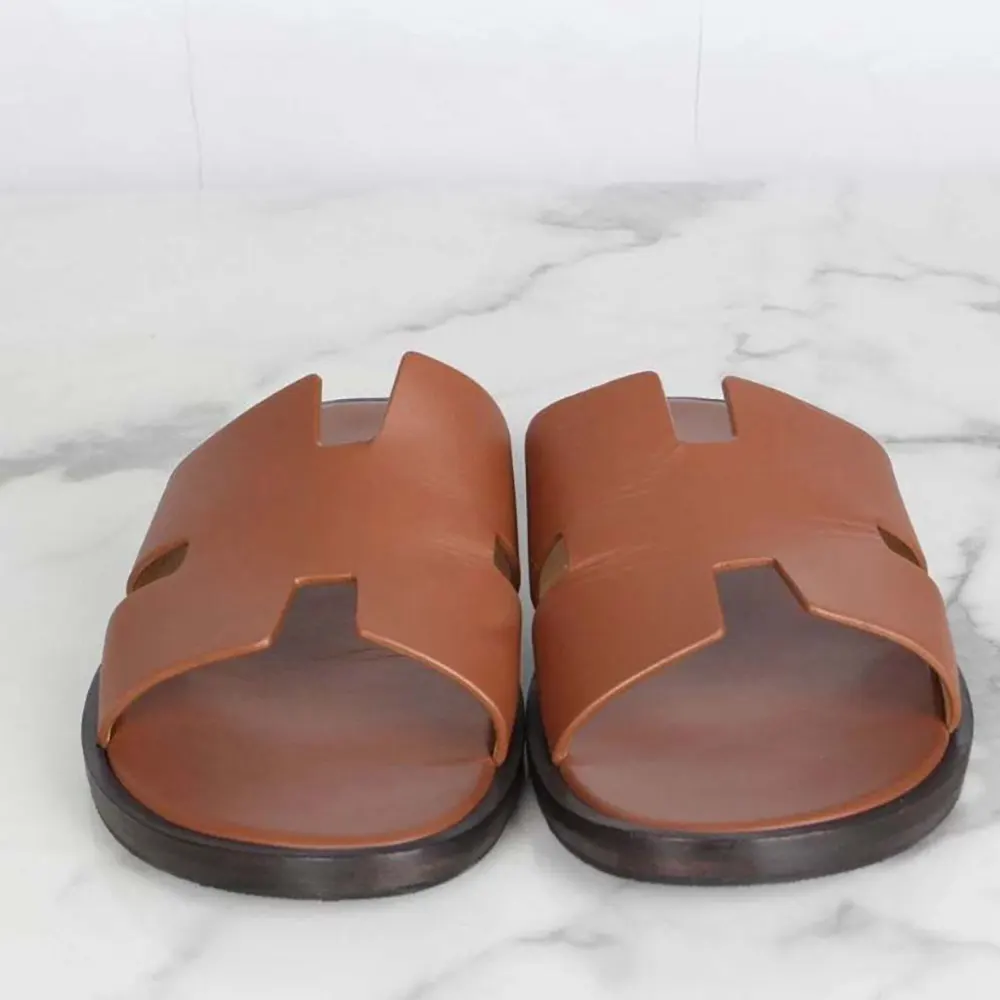 Front angle showcasing Hermes Unisex Izmir Sandal-Brown open-toe design
