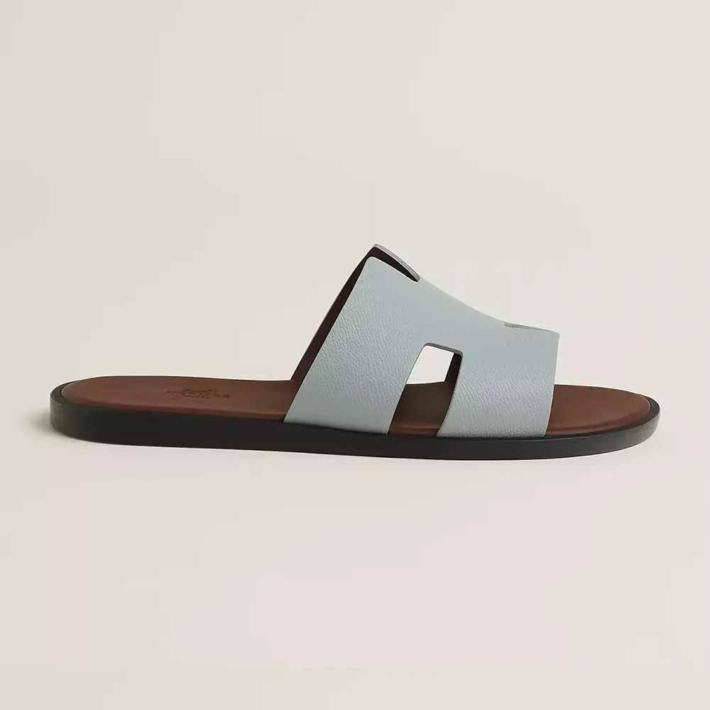 Side profile of Hermes Unisex Izmir Sandal-Light Blue showing signature H cutout