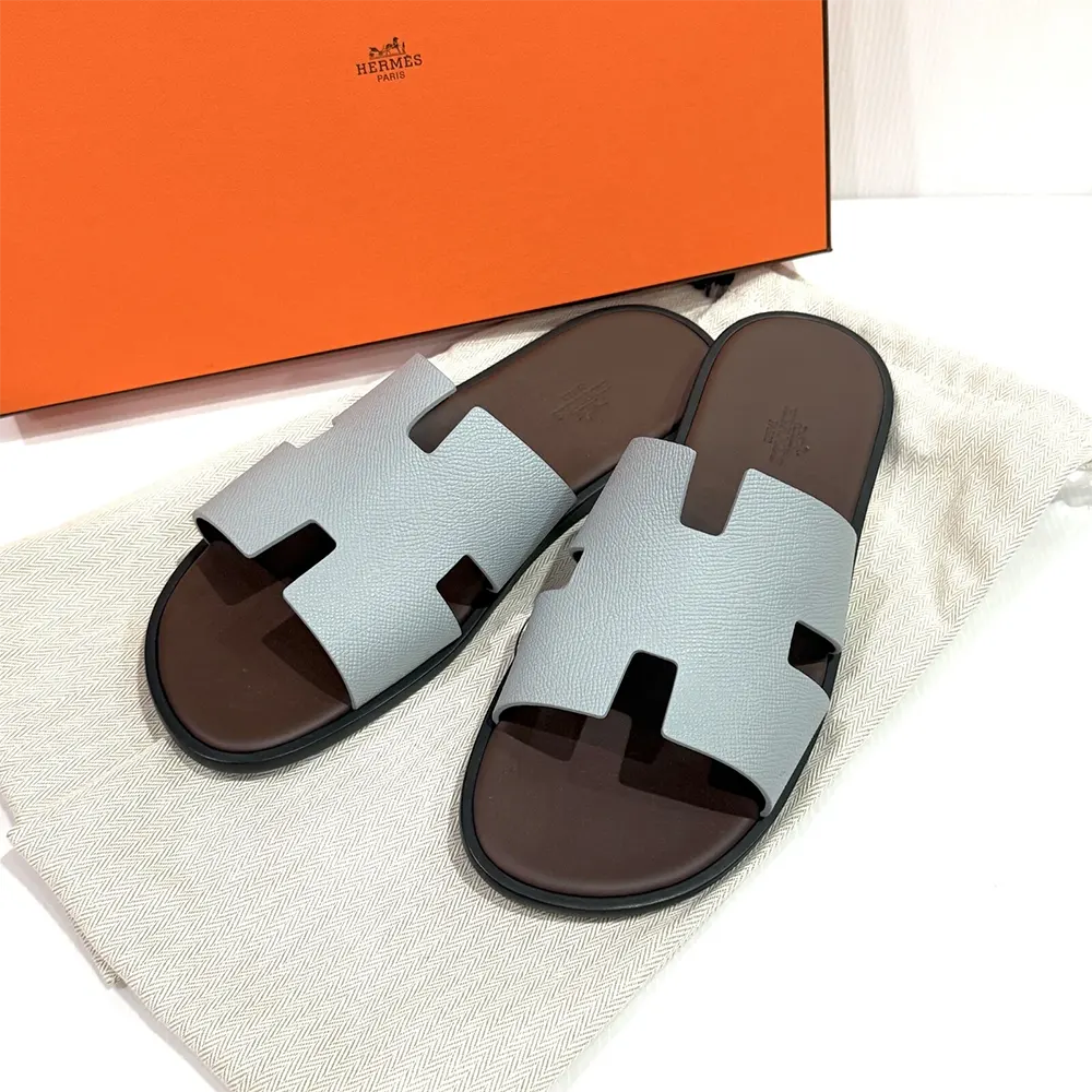 Close-up of light blue leather and silver hardware on Hermes Unisex Izmir Sandal-Light Blue