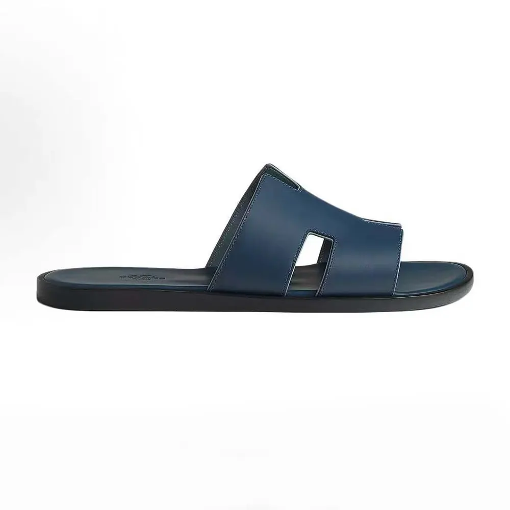 Side profile of Hermes Unisex Izmir Sandal-Navy showing signature H cut-out