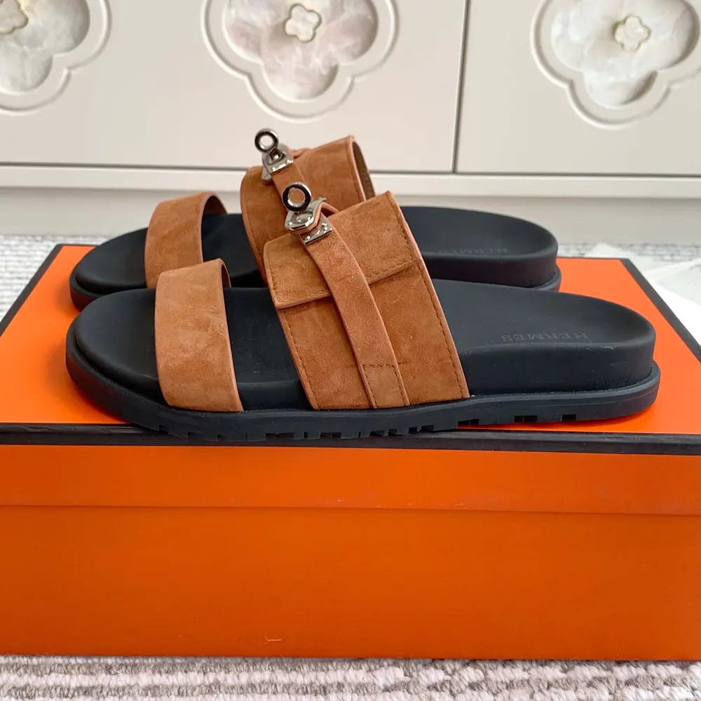 Close-up of sole and hand-stitched edges on Hermes Jackson Sandal-Brown