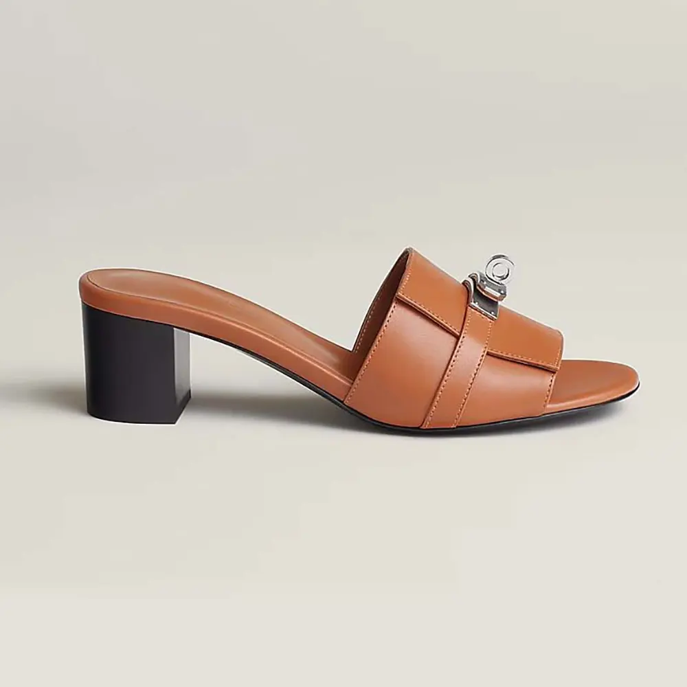 Side view of Hermes Women Gigi 50 Sandal-Brown showing leather and heel