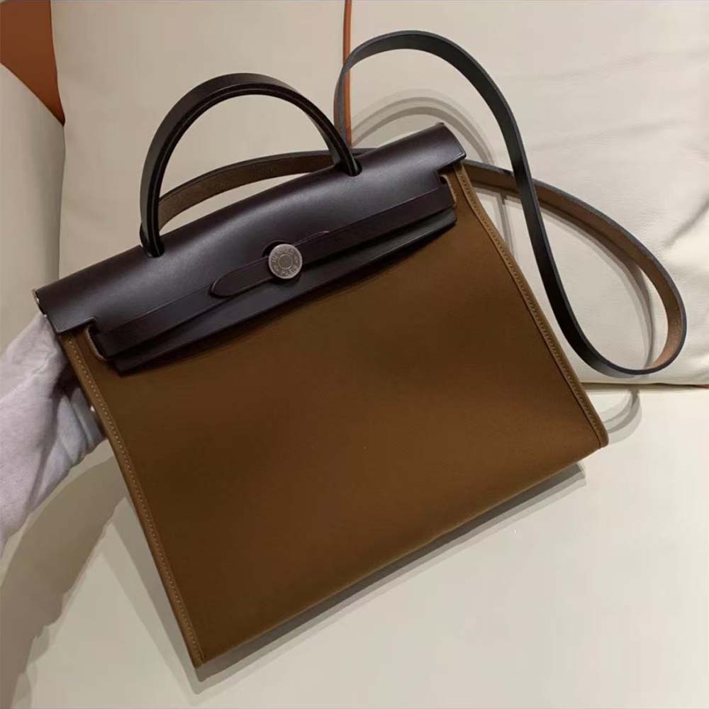Close-up of silver-tone hardware on Hermes Women Herbag Zip 31 Bag-Brown/Black