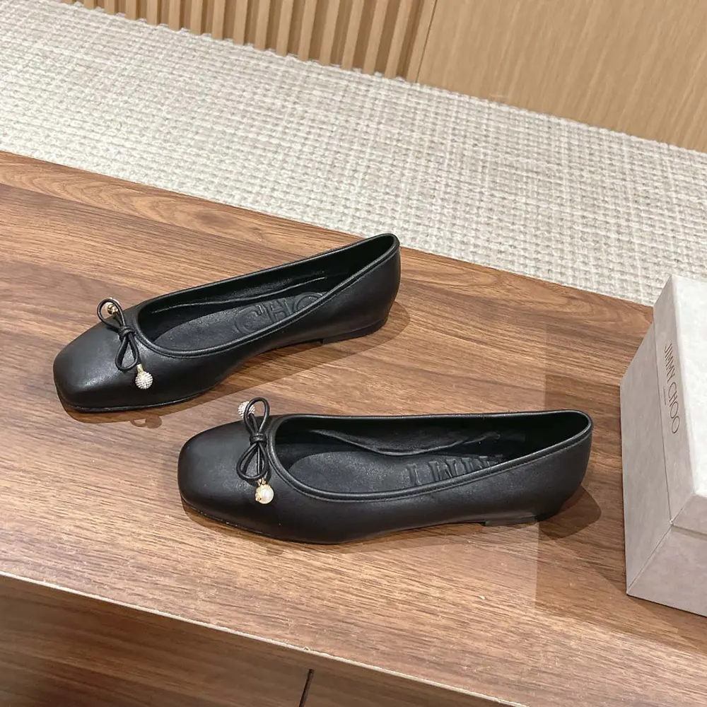 Top-down angle showing black nappa leather and silhouette of Jimmy Choo Women Elme Flats
