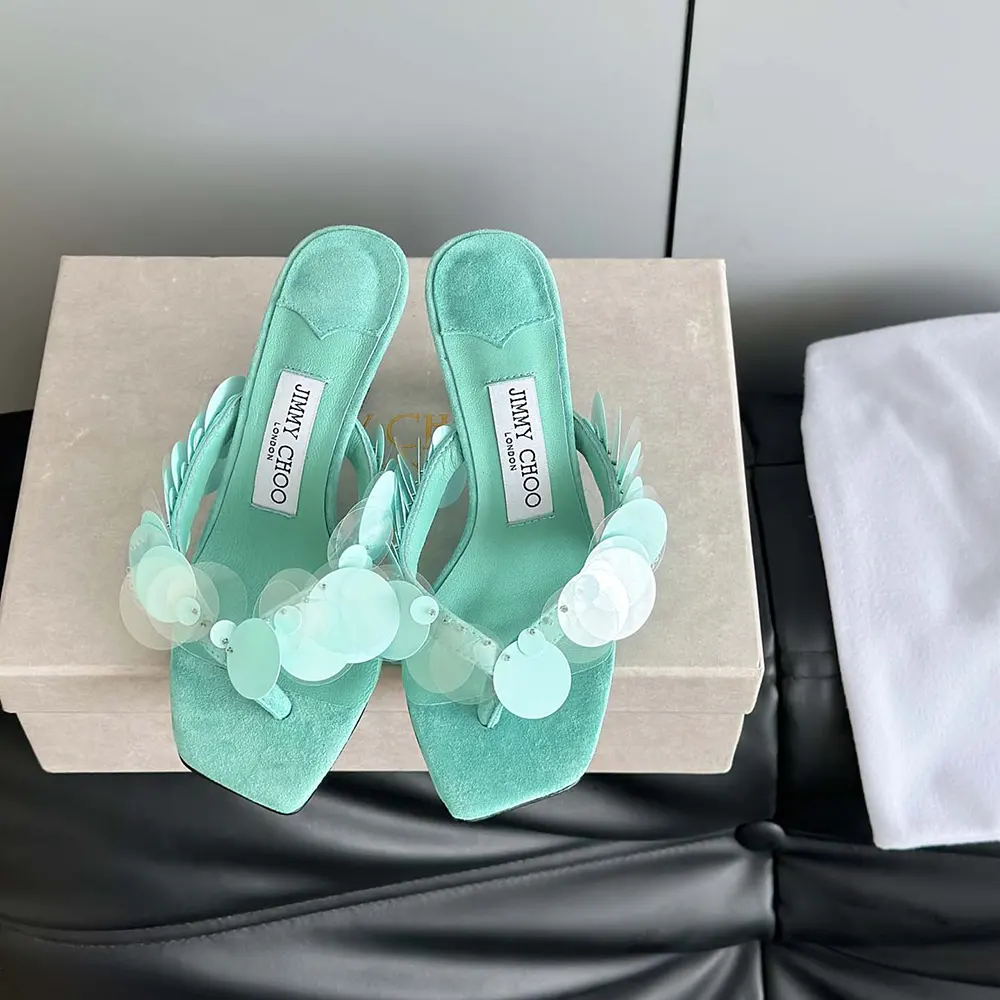 Close-up of aqua green suede and paillette detail on Jimmy Choo sandals