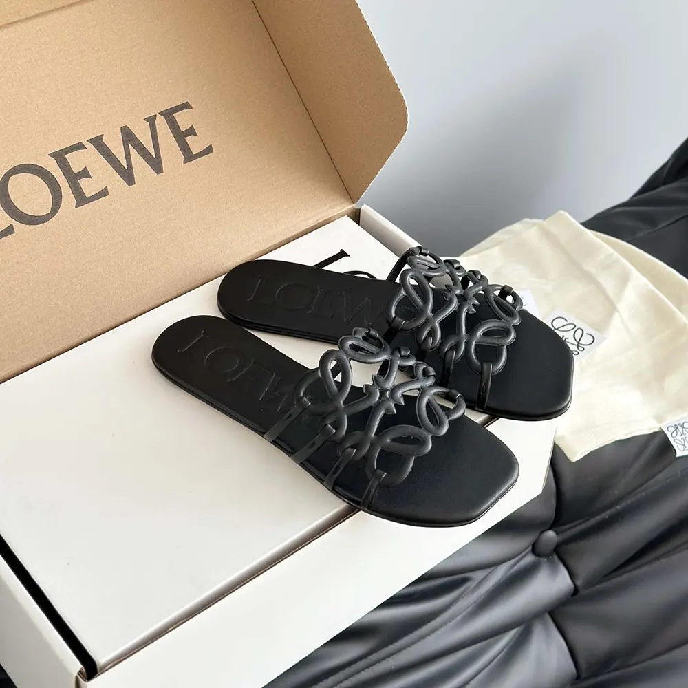 Overhead shot showing black calfskin leather texture on Loewe slide