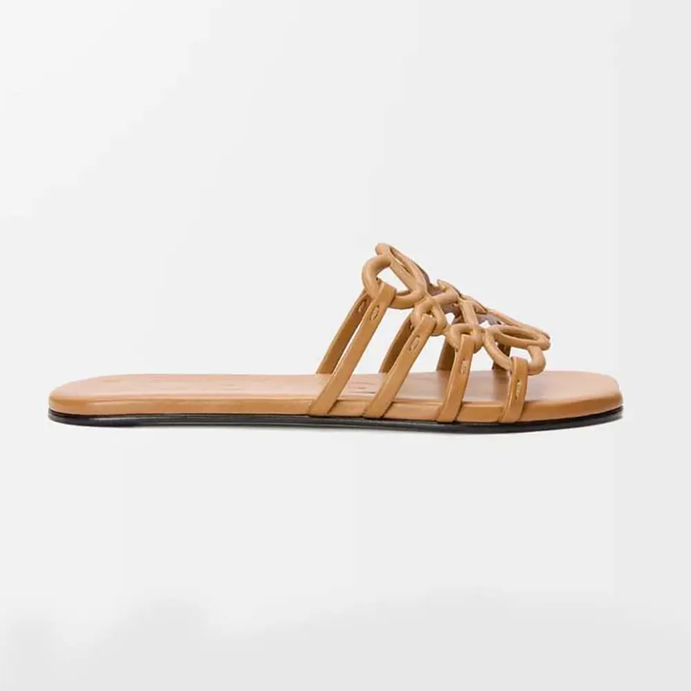 Side profile of Loewe Women Petal Anagram Slide in soft brown calfskin