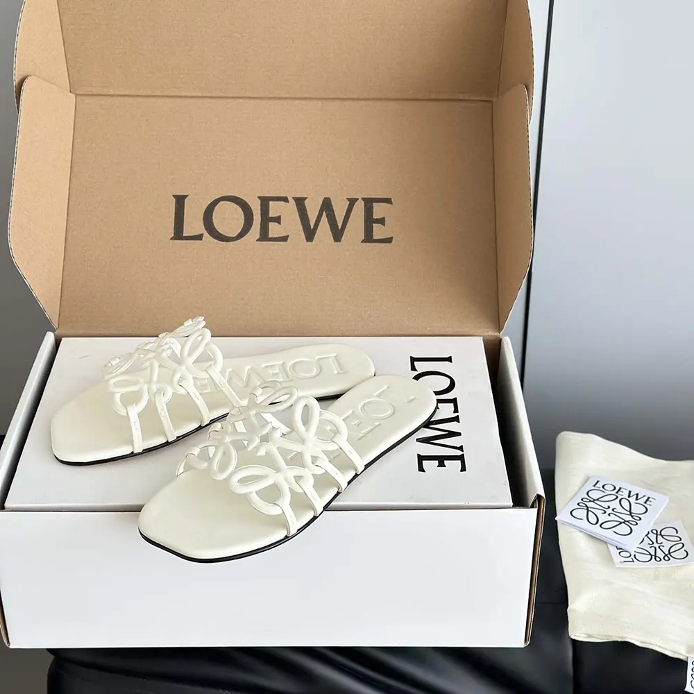 Top angle showing open-toe silhouette of Loewe Women Petal Anagram Slide
