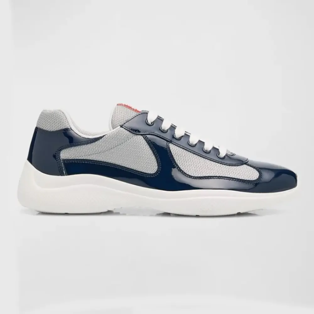 Side view of Prada Unisex America’s Cup Patent Leather Patchwork Sneakers in navy