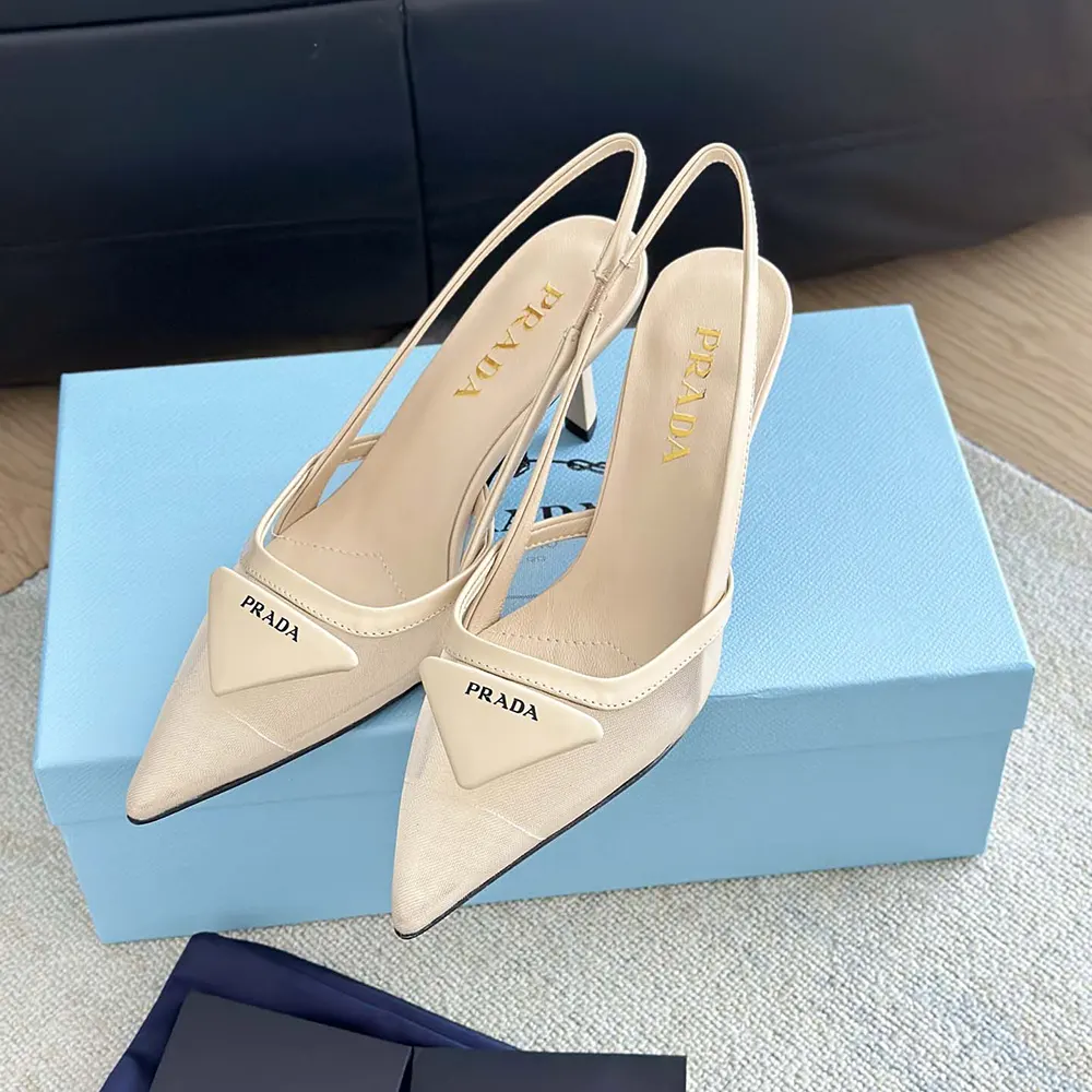 Close-up of slingback strap and Prada logo on beige pumps
