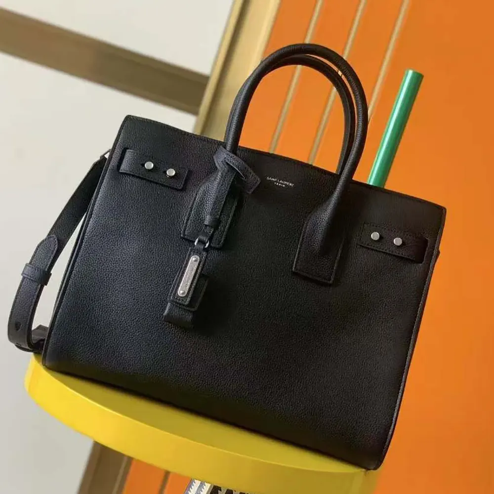 Side angle showing slim large silhouette of Saint Laurent Sac De Jour bag