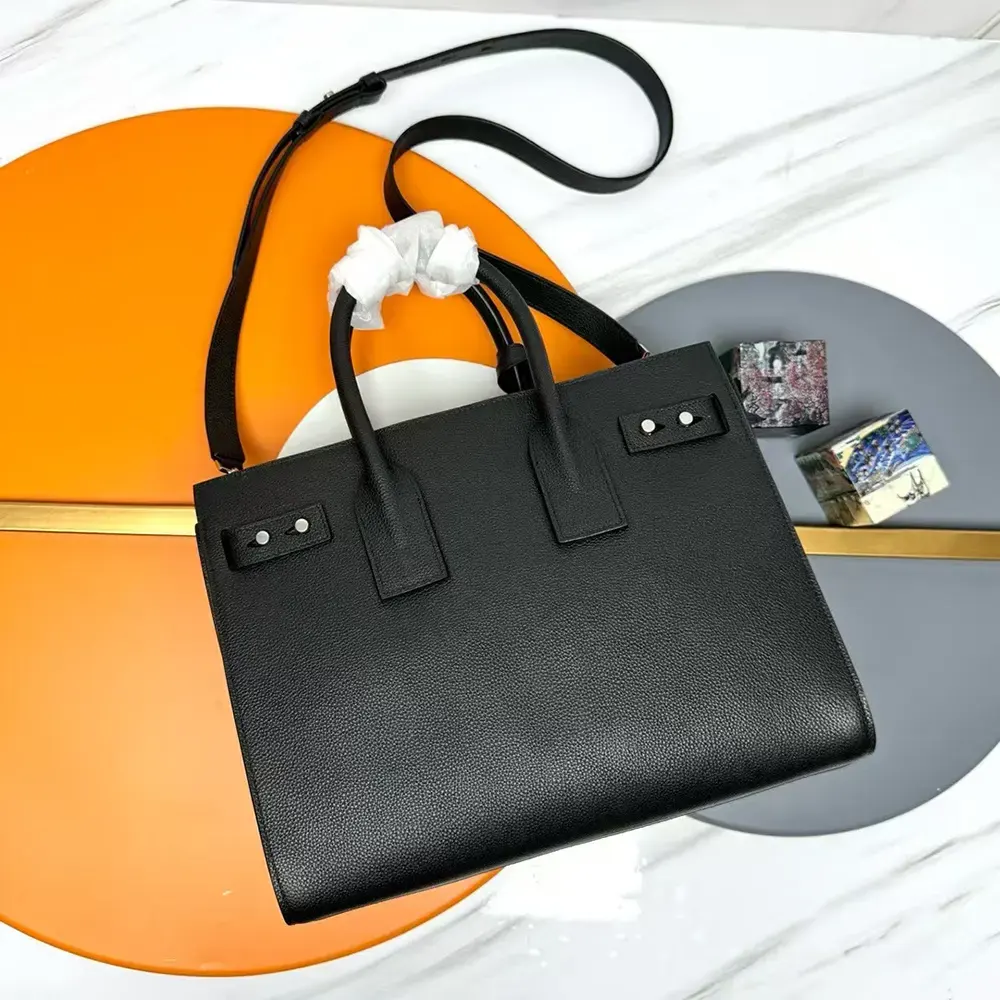 Side profile showing structured silhouette of the Saint Laurent YSL Sac De Jour