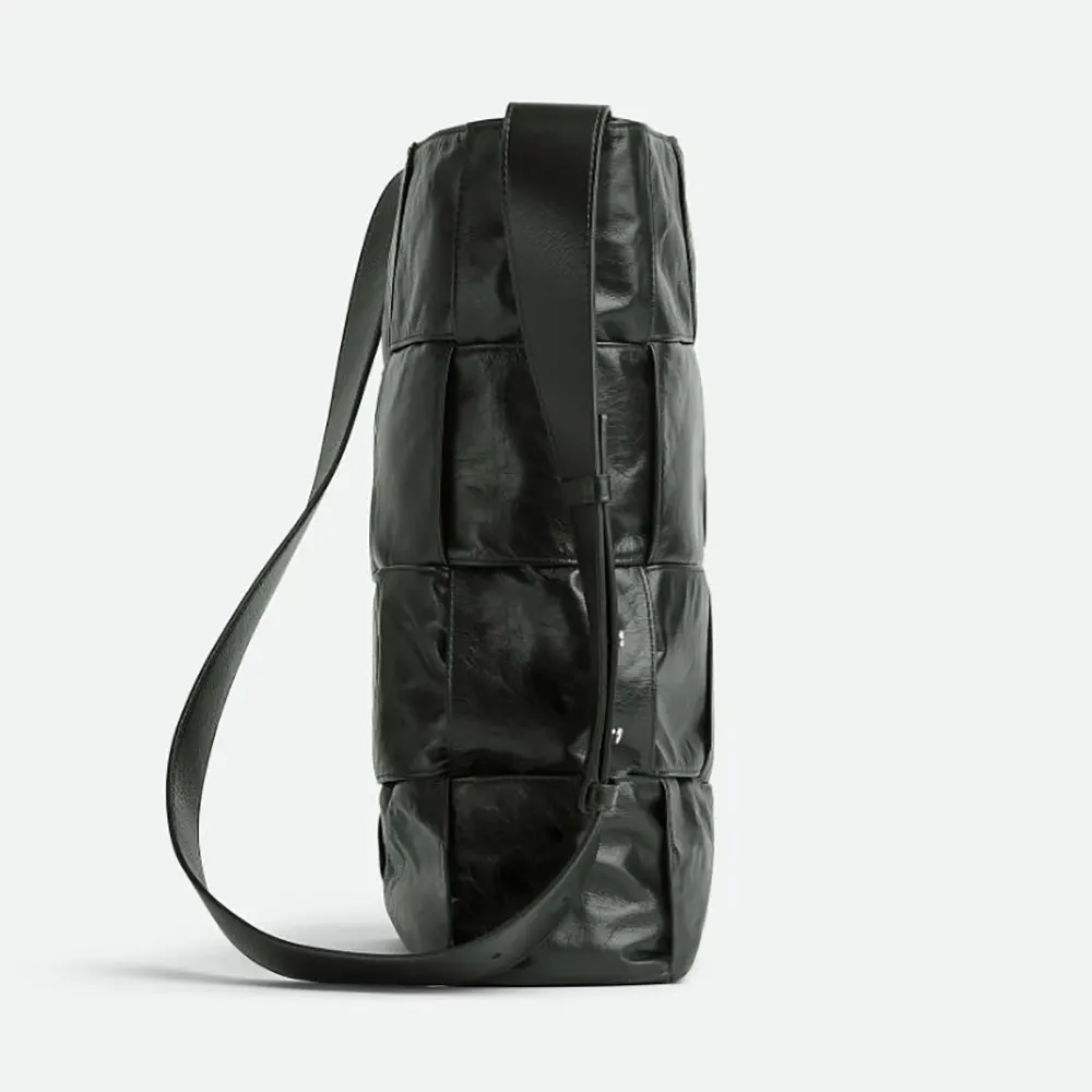 Side angle showing silhouette and strap of Bottega Veneta Unisex Arco Hobo Bag