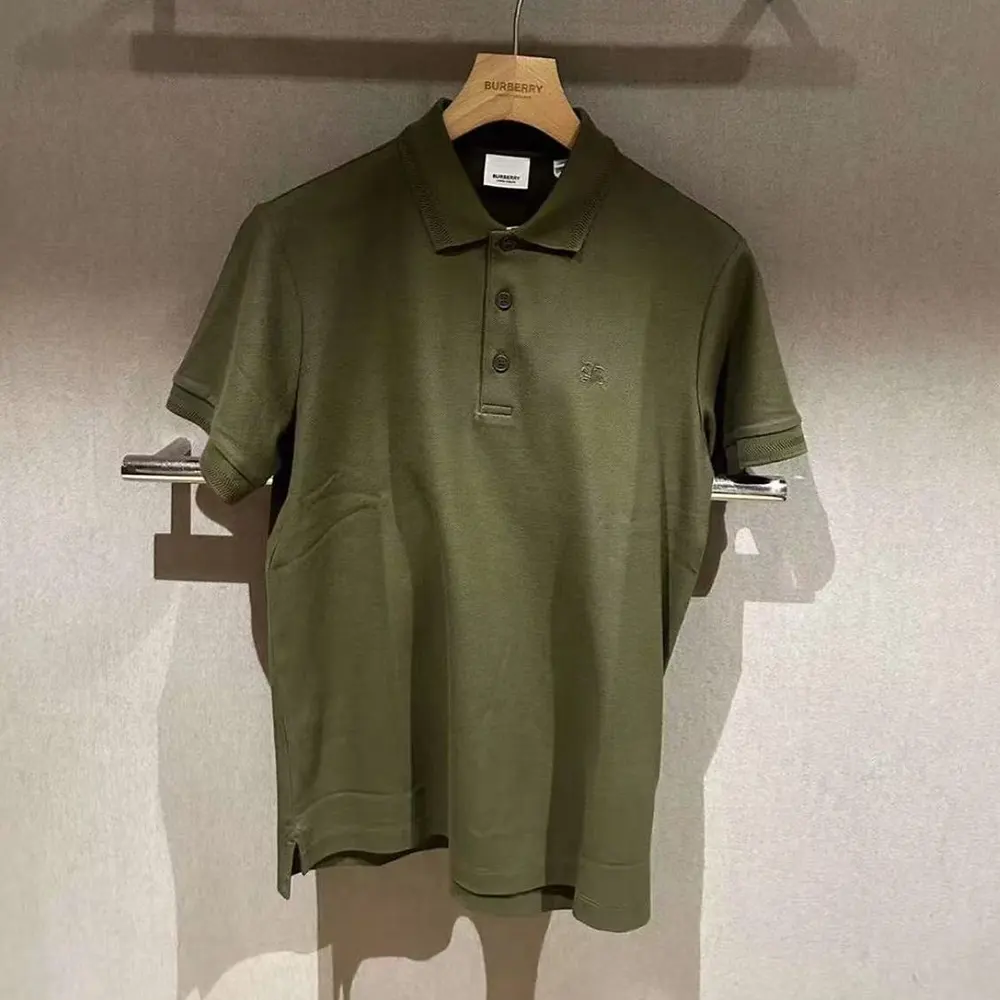 Close-up of equestrian knight embroidery on Burberry Men Cotton Polo Shirt