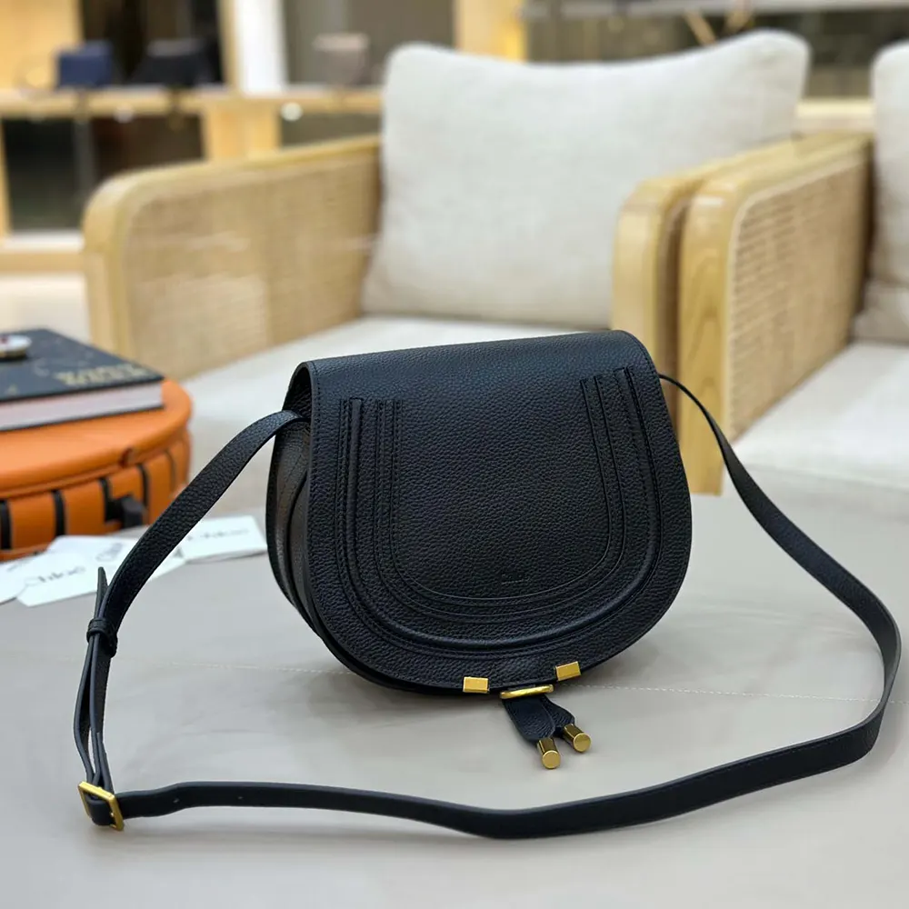 Side angle showing antique gold hardware on Chloe Women Marcie Saddle Bag