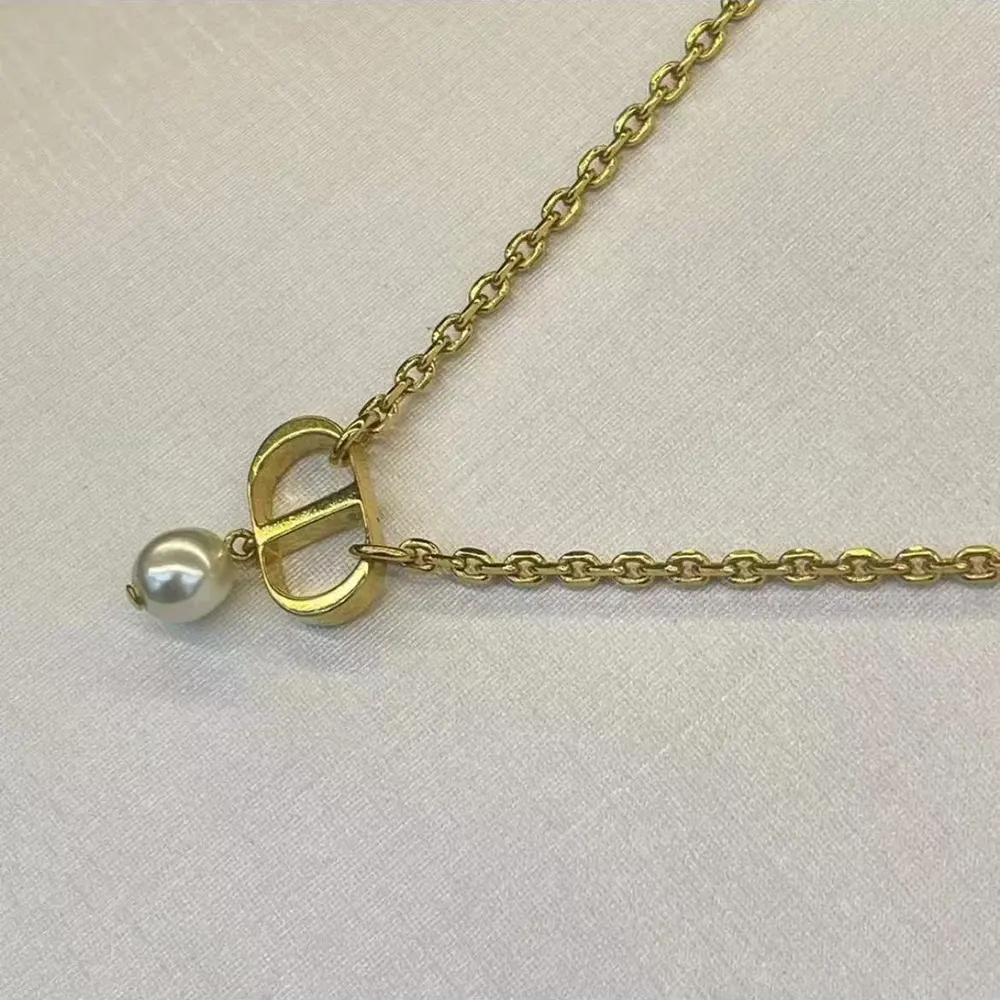 Side view of Dior Women Petit CD Necklace highlighting clasp and chain