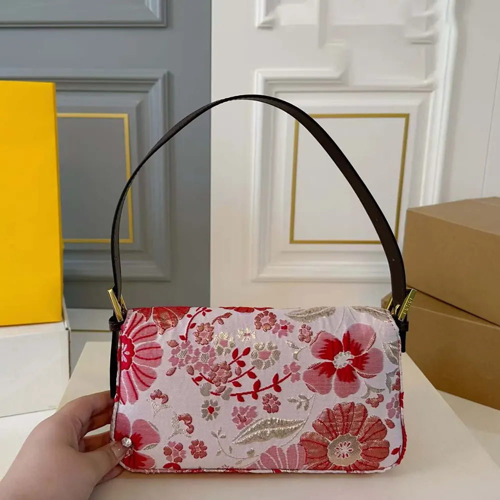 Side angle showing gold hardware on Fendi Women Baguette Canvas Bag