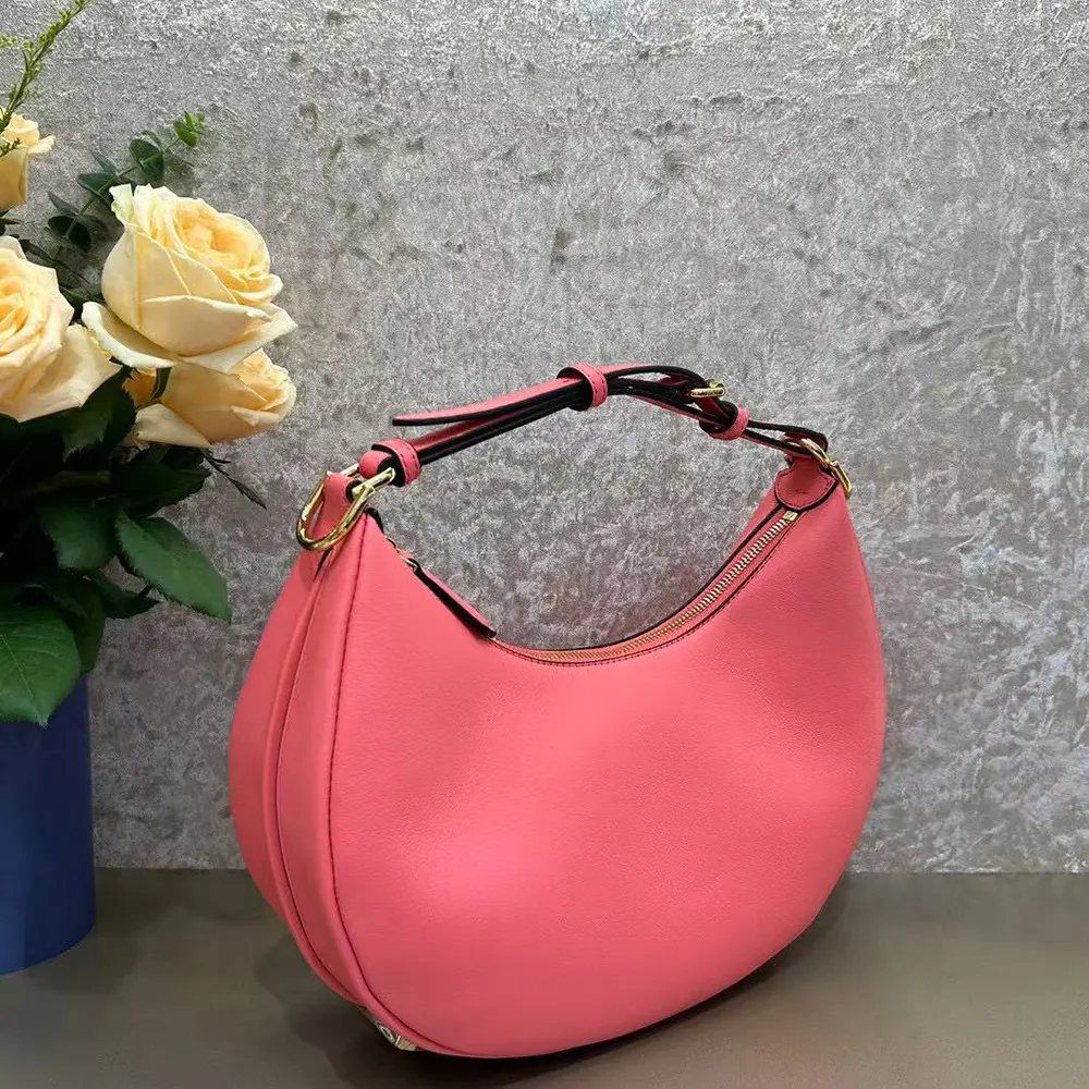 Close-up on silver hardware and pink leather texture of Fendi Fendigraphy bag