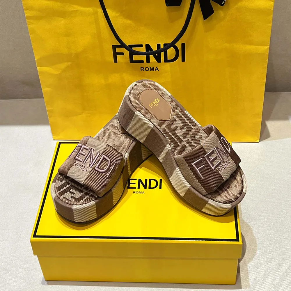 Close-up detail of denim-effect jacquard fabric on Fendi flatform slides