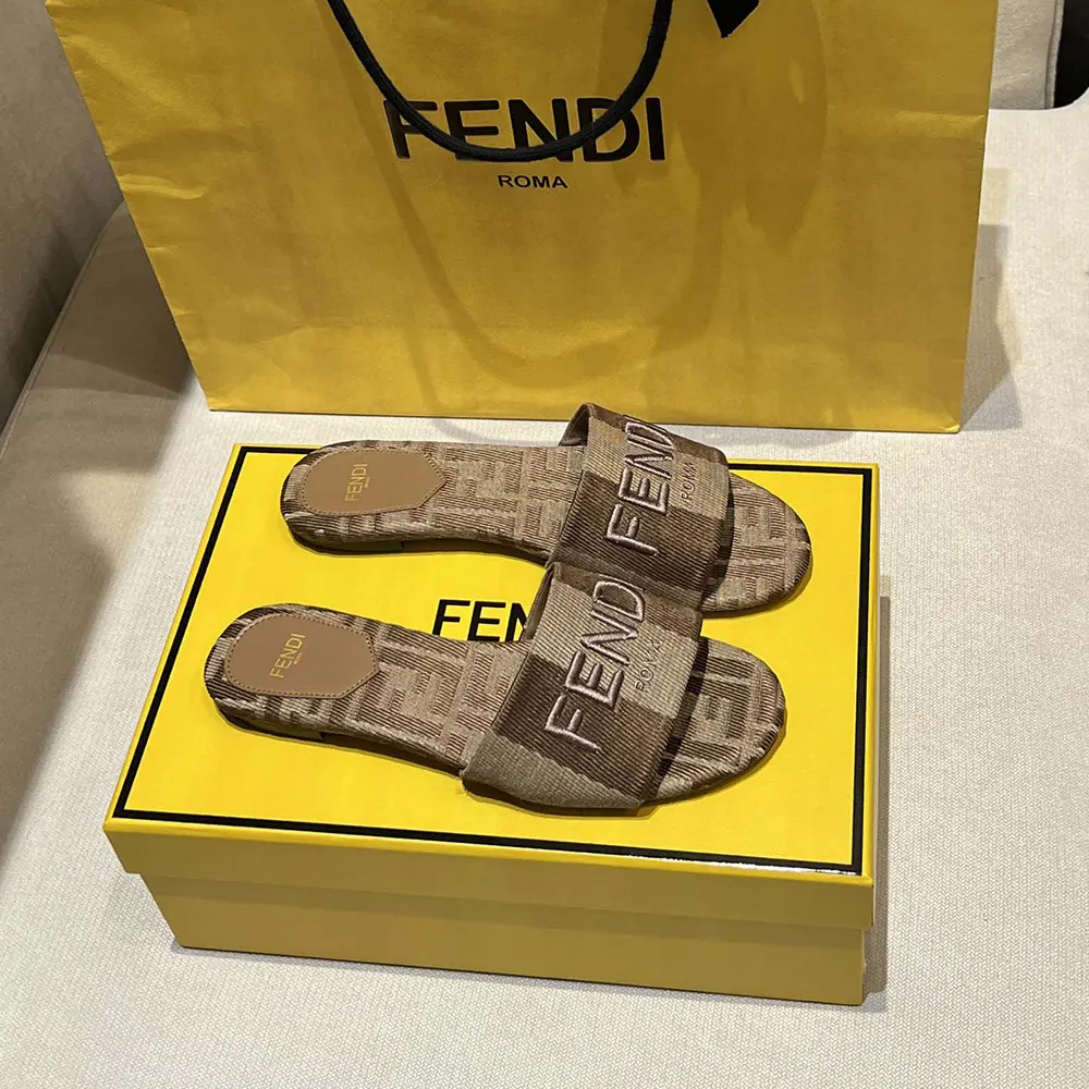 Close-up of gray denim-effect jacquard material on Fendi Sunshine Dove slides