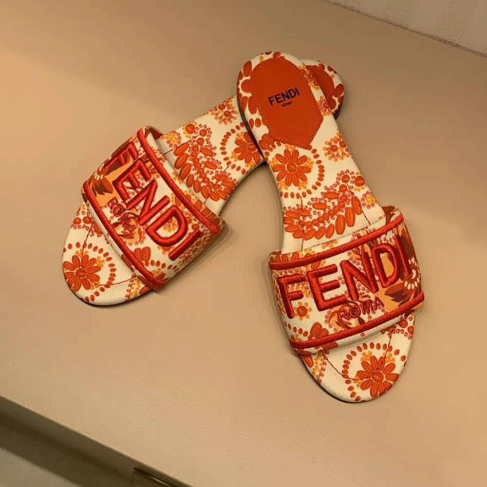 Top-down look at vibrant red canvas of Fendi Women Sunshine Slides
