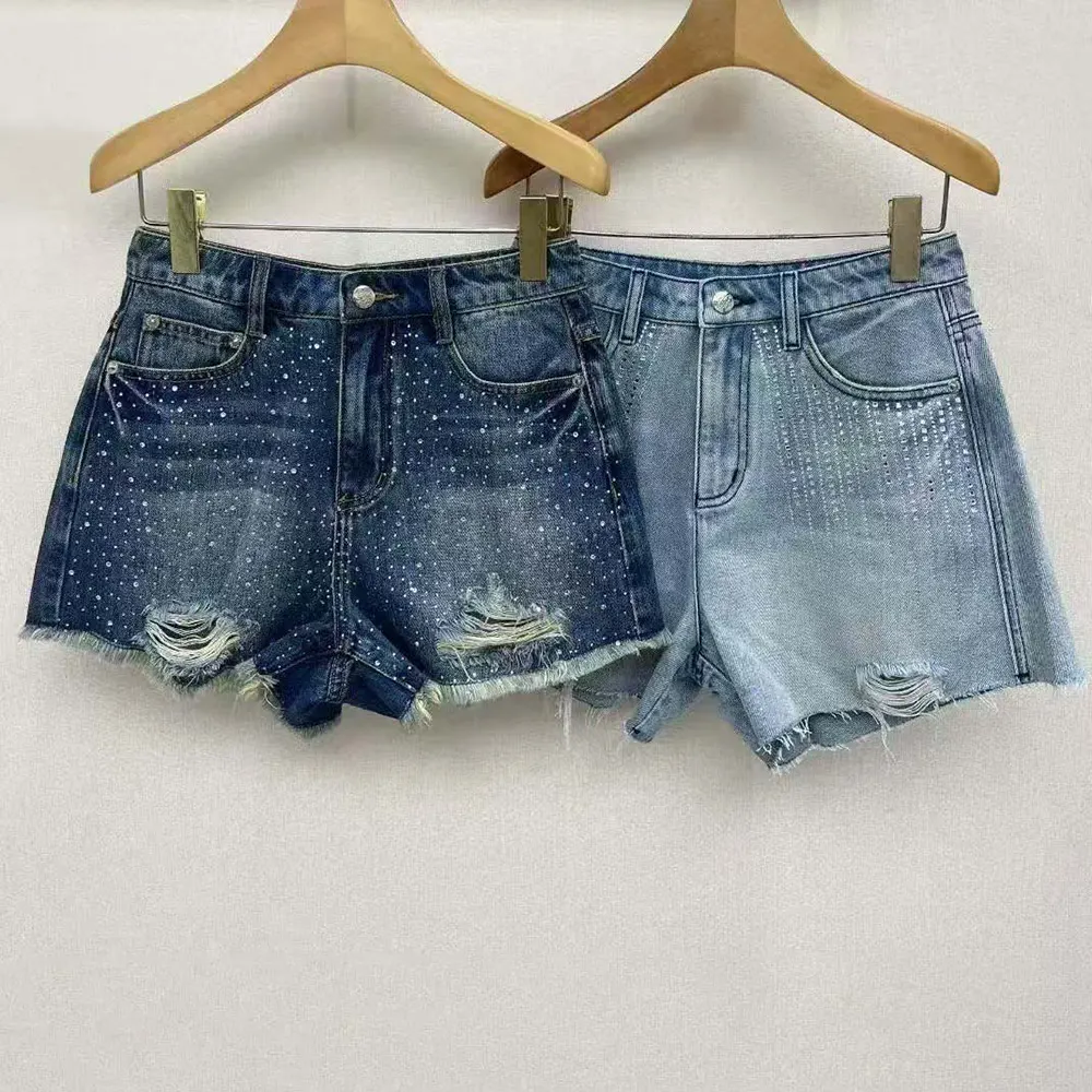 Side angle of Loewe Women Anagram Shorts in Denim highlighting silhouette