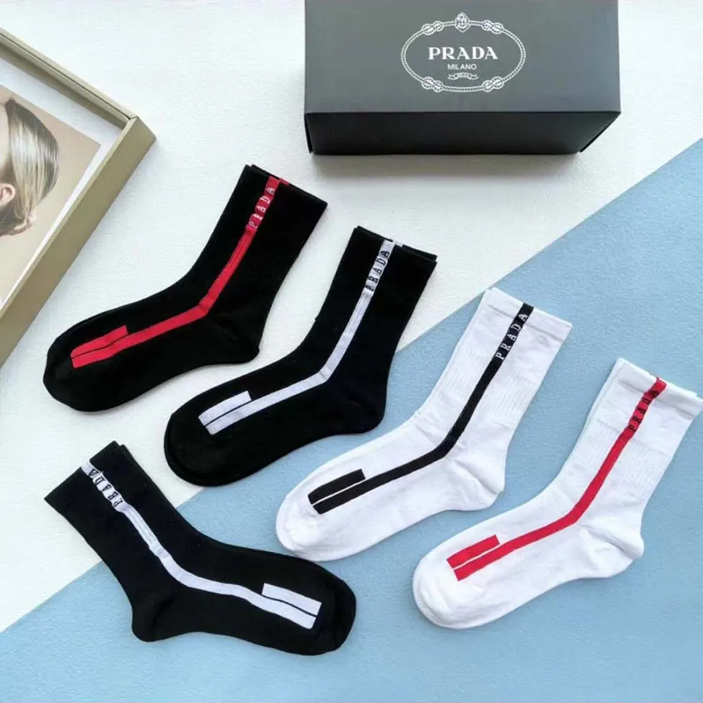 Pack of five Prada Unisex Re-Nylon Knit Socks neatly folded on white background
