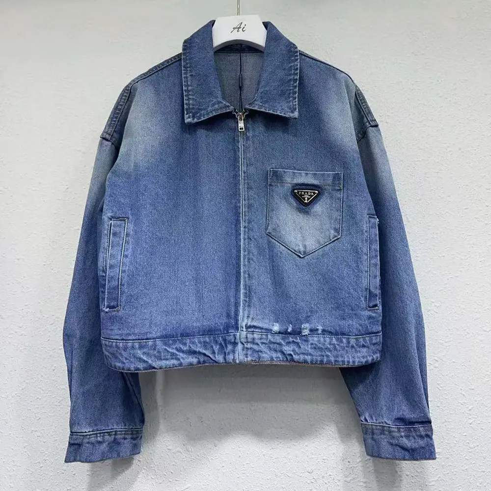 Close-up of branded metal buttons on Prada Women Cropped Organic Denim Jacket