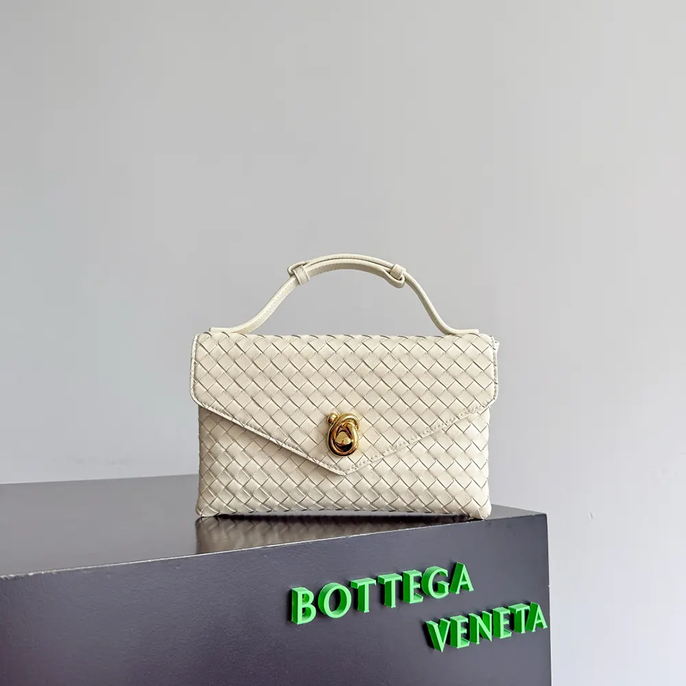 Side profile showing adjustable strap of Bottega Veneta white shoulder bag