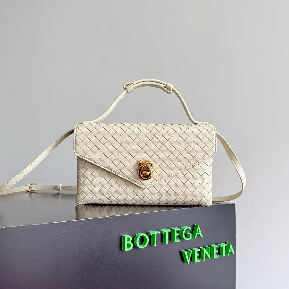 Close-up of signature knot lock on white Intrecciato Piccolo leather bag