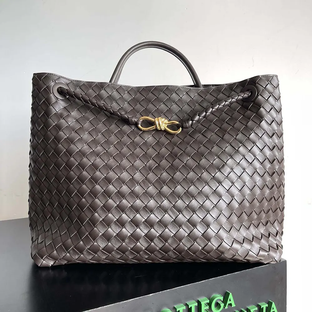 Close-up of woven leather detail and gold hardware on the bag
