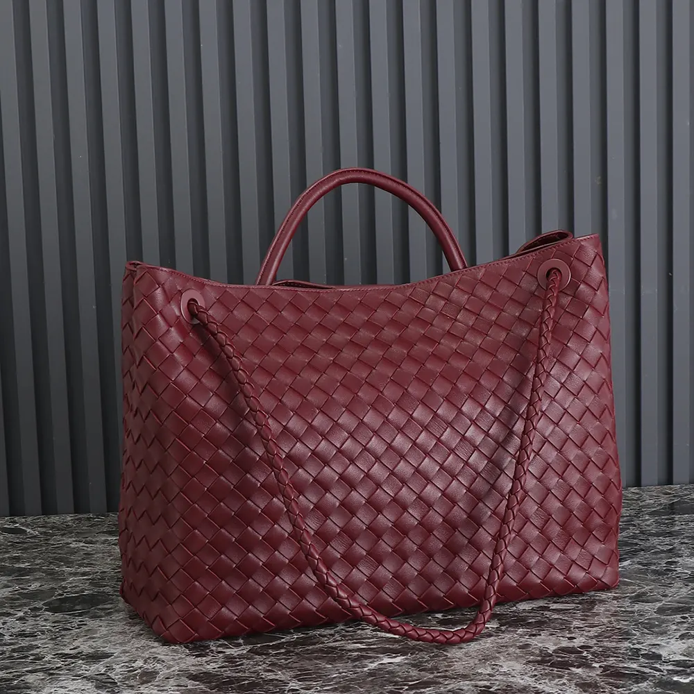 Side angle showing spacious silhouette of Bottega Veneta Large Andiamo bag