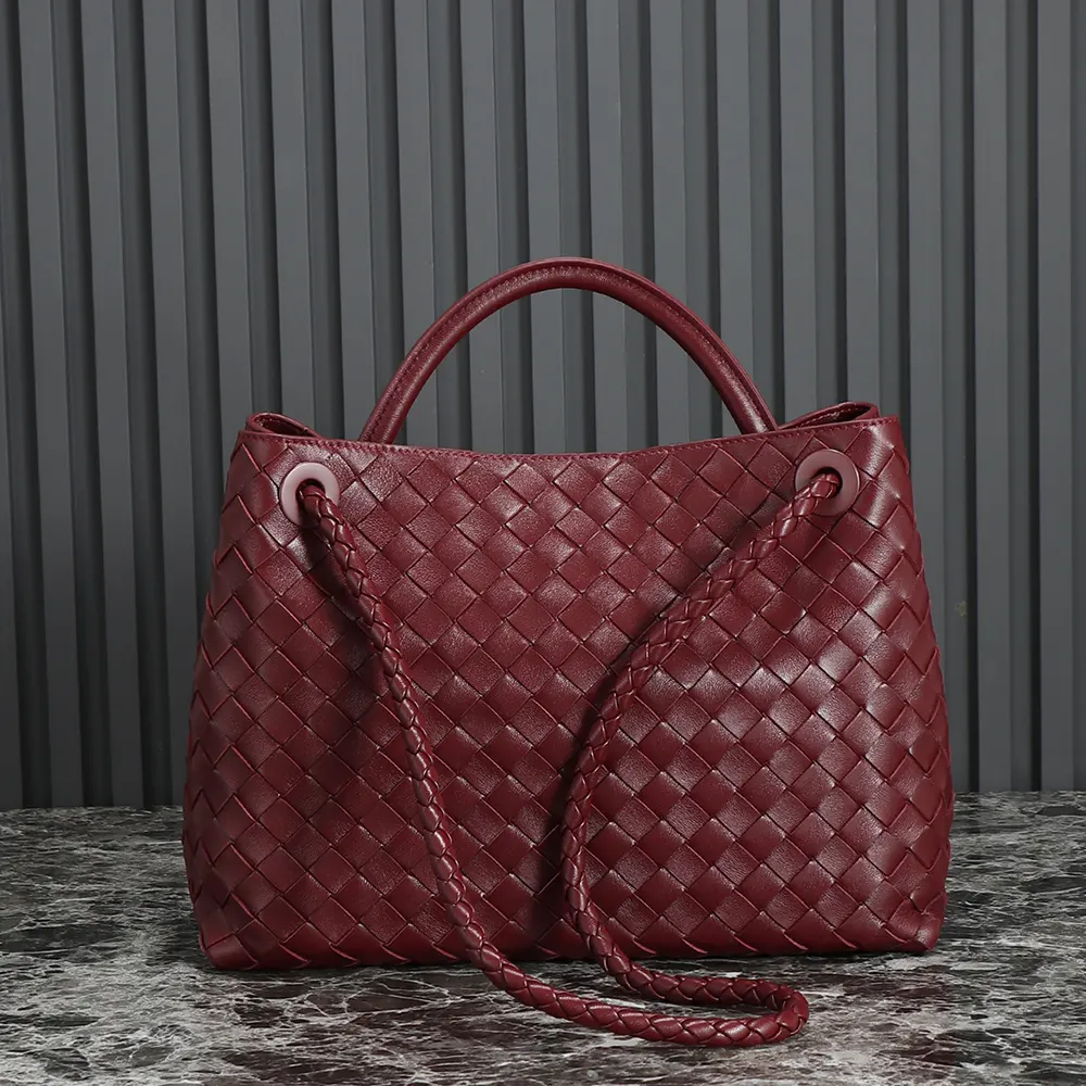 Side angle showing brushed gold hardware on Bottega Veneta Women Medium Andiamo