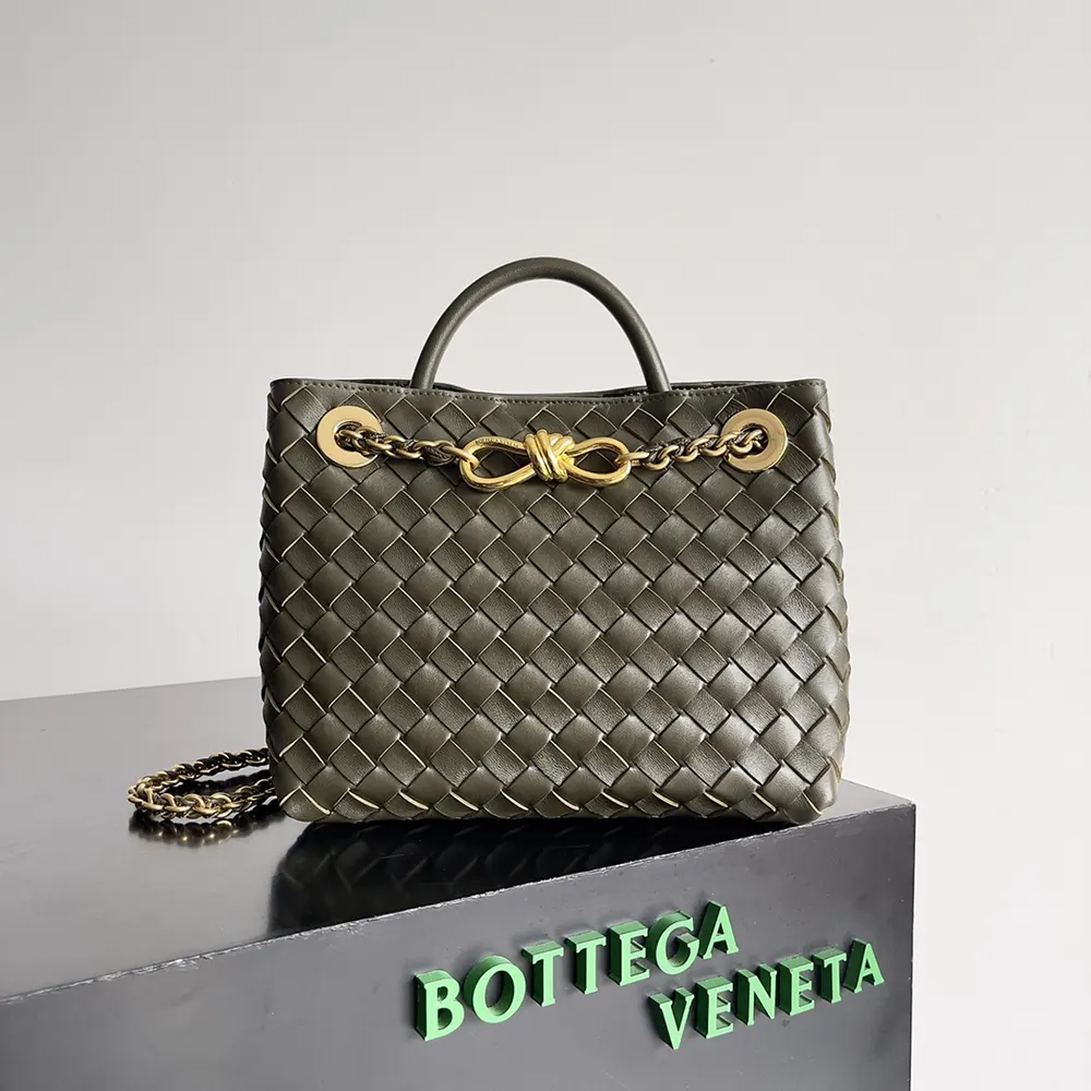 Close-up on intrecciato leather weave and brushed gold hardware of Bottega Veneta Andiamo bag