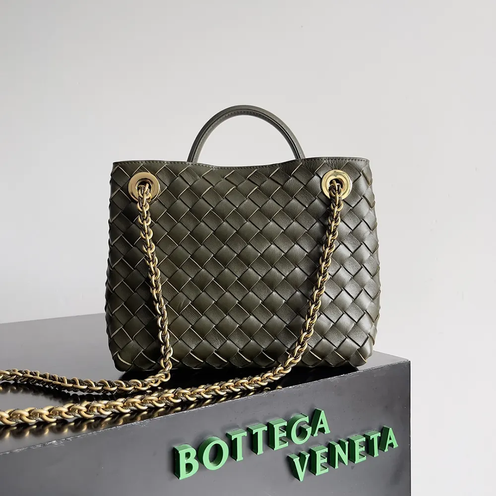 Side angle showing compact silhouette of Bottega Veneta Women Small Andiamo Top Handle Bag in dark green