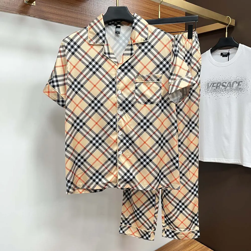 Close-up of Burberry check pattern on silk fabric with button details